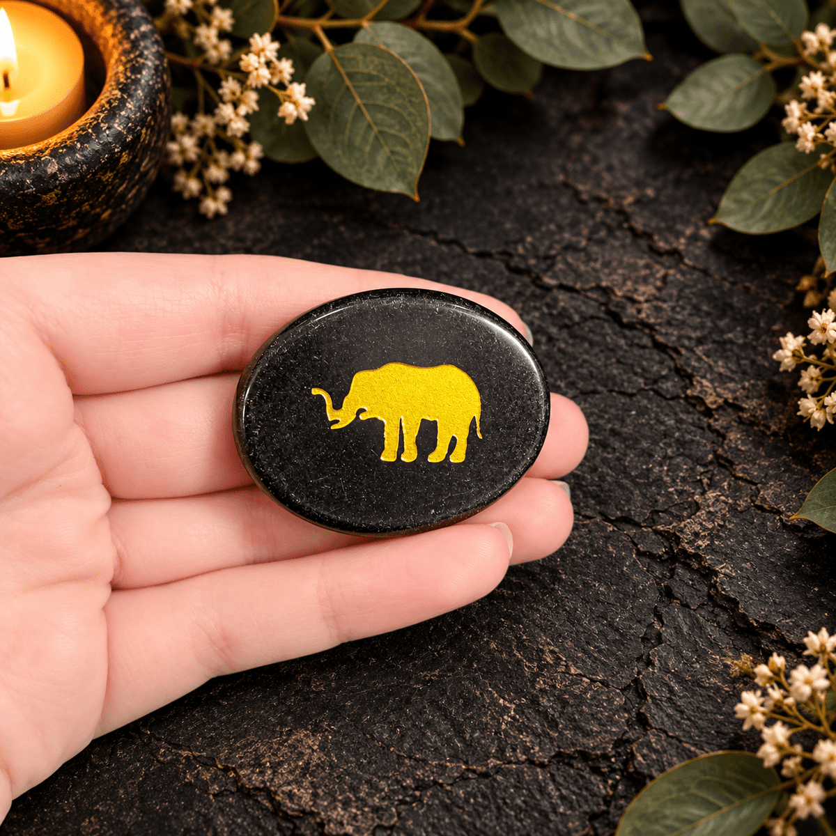 Gold Elephant on Black Obsidian Palm